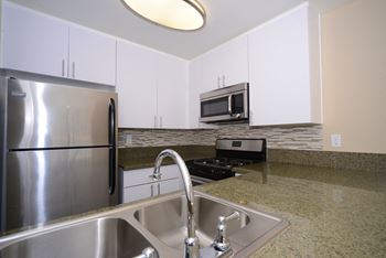 Indie Westside kitchen with appliances